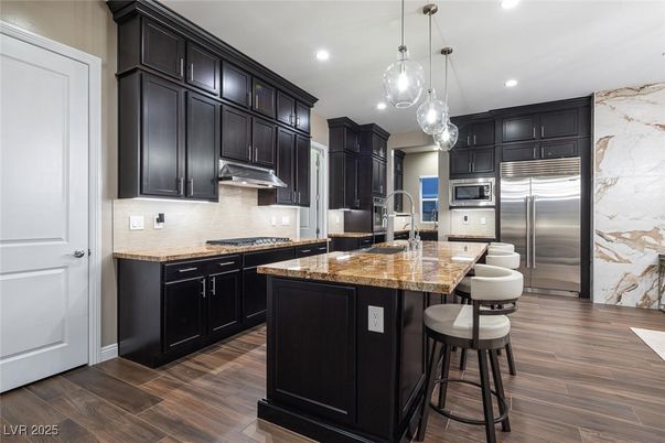 Interior, Kitchen, Marble Walls, Pendant Lights, Recessed Lighting, Stainless Steel Appliances, Wood Texture Flooring