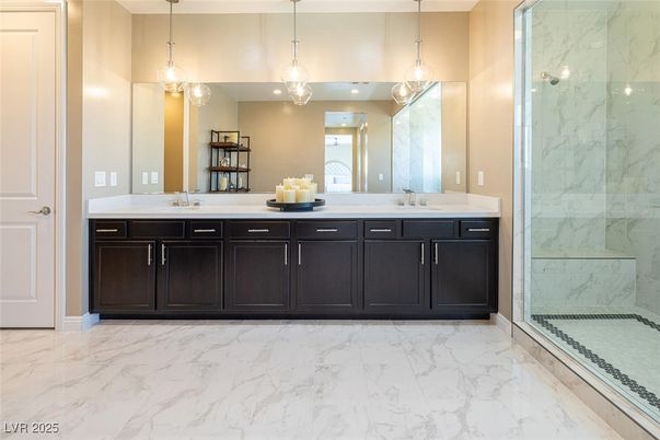 Bathroom, Dual Sink Vanities, Glass Shower, Interior, Marble, Marble Walls, Pendant Lights