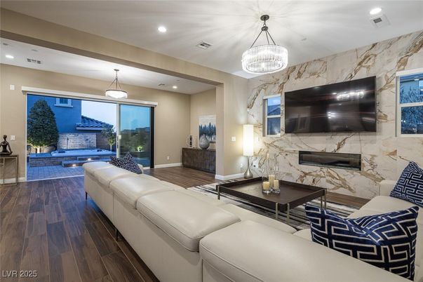 Fireplace, Interior, Living room, Marble Walls, Pendant Lights, Recessed Lighting, Wood Texture Flooring
