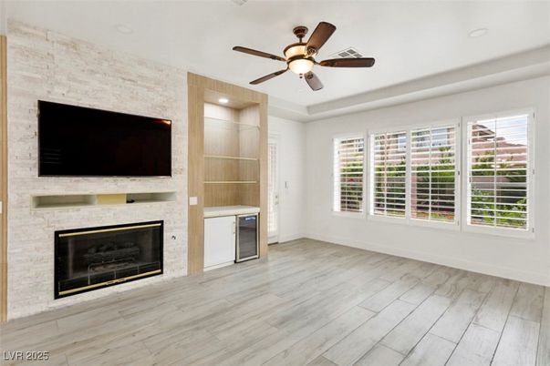 Empty room, Fireplace, Interior, Recessed Lighting, Stone Walls, Wood Texture Flooring