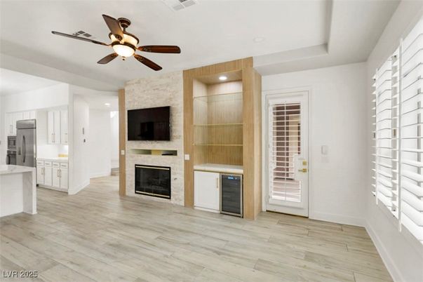 Empty room, Fireplace, Interior, Kitchen, Recessed Lighting, Stone Walls, Wood Texture Flooring