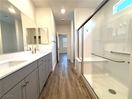 Bathroom, Dual Sink Vanities, Glass Shower, Interior, Recessed Lighting, Wood Texture Flooring