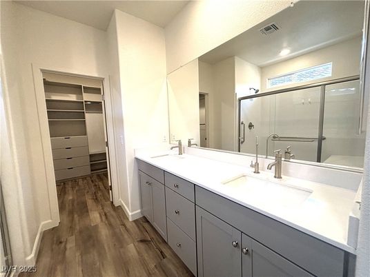 Bathroom, Dual Sink Vanities, Glass Shower, Interior, Recessed Lighting, Walk-in Closets, Wood Texture Flooring