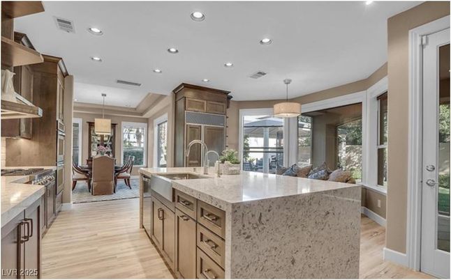 Chandelier, Dining room, Interior, Kitchen, Pendant Lights, Recessed Lighting, Stainless Steel Appliances, Wood Texture Flooring