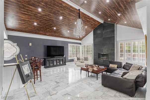 Chandelier, Fireplace, Interior, Living room, Marble, Recessed Lighting, Wooden Ceilings