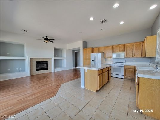 Empty room, Fireplace, Interior, Kitchen, Recessed Lighting, Wood Texture Flooring