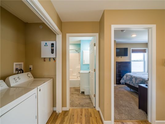 Bedroom, Interior, Recessed Lighting, Utility Closets, Washer, Wood Texture Flooring
