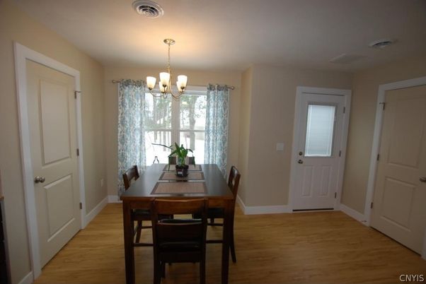 Chandelier, Dining room, Interior, Wood Texture Flooring