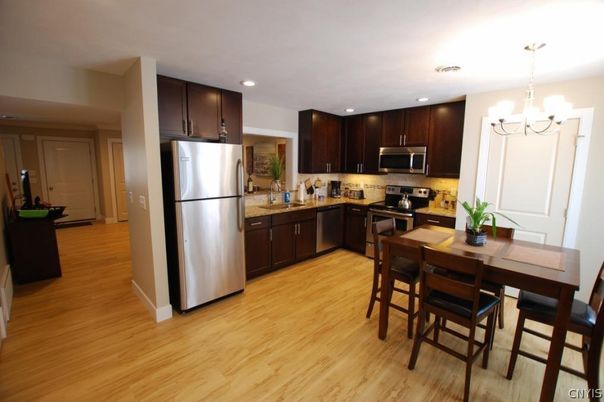 Chandelier, Dining room, Interior, Kitchen, Recessed Lighting, Stainless Steel Appliances, Wood Texture Flooring