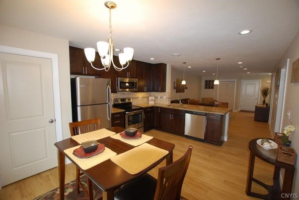 Chandelier, Dining room, Interior, Kitchen, Pendant Lights, Recessed Lighting, Stainless Steel Appliances, Wood Texture Flooring