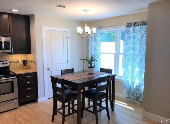 Chandelier, Dining room, Interior, Kitchen, Pendant Lights, Recessed Lighting, Stainless Steel Appliances, Wood Texture Flooring