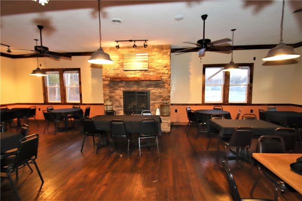 Dining room, Fireplace, Interior, Pendant Lights, Stone Walls, Wood Texture Flooring