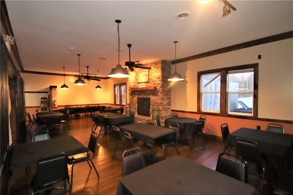 Dining room, Fireplace, Interior, Pendant Lights, Stone Walls, Wood Texture Flooring