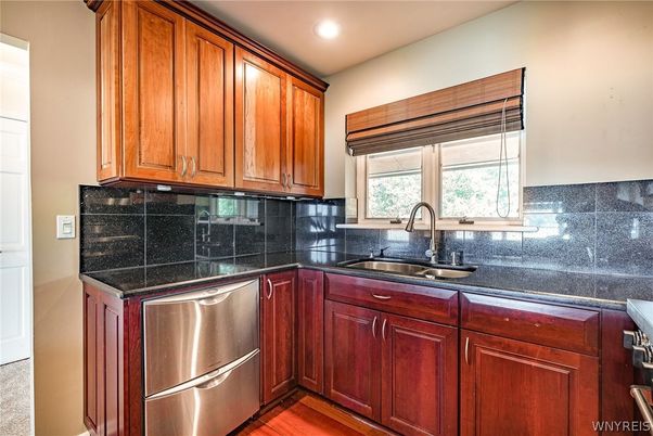Interior, Kitchen, Recessed Lighting, Stainless Steel Appliances, Tile Countertops, Wood Texture Flooring