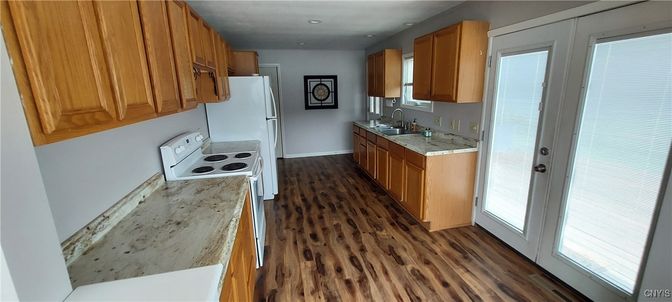 Interior, Kitchen, Recessed Lighting, Washer, Wood Texture Flooring