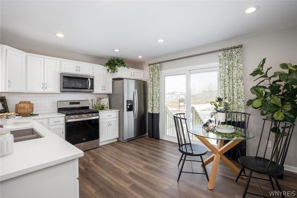 Dining room, Interior, Kitchen, Recessed Lighting, Stainless Steel Appliances, Wood Texture Flooring