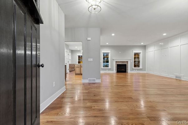 Empty room, Fireplace, Interior, Pendant Lights, Recessed Lighting, Wood Texture Flooring