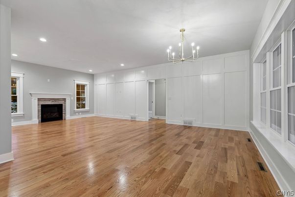 Chandelier, Empty room, Fireplace, Interior, Recessed Lighting, Wood Texture Flooring