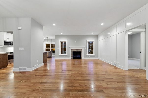 Empty room, Fireplace, Interior, Kitchen, Pendant Lights, Recessed Lighting, Wood Texture Flooring