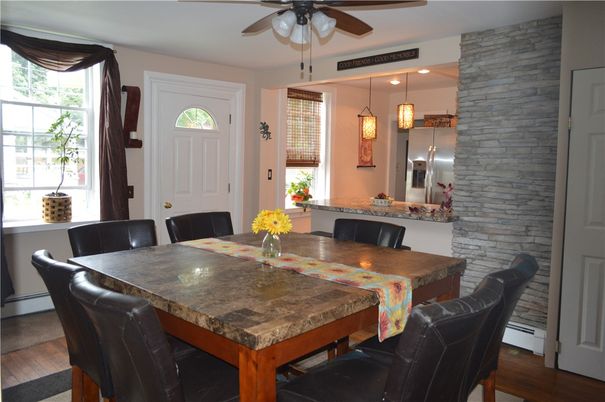 Dining room, Interior, Kitchen, Pendant Lights, Stainless Steel Appliances, Stone Walls, Wood Texture Flooring