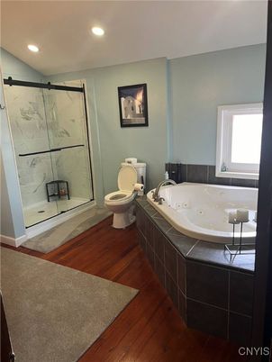 Bathroom, Glass Shower, Interior, Marble Walls, Recessed Lighting, Wood Texture Flooring