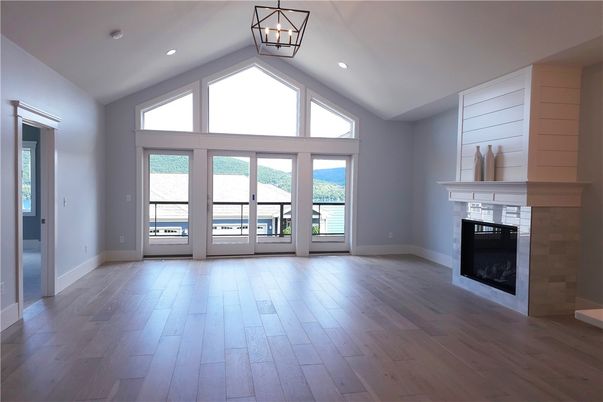 Empty room, Fireplace, Interior, Pendant Lights, Recessed Lighting, Wood Texture Flooring