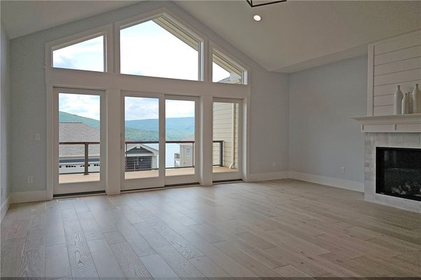 Empty room, Fireplace, Interior, Recessed Lighting, Water, Wood Texture Flooring