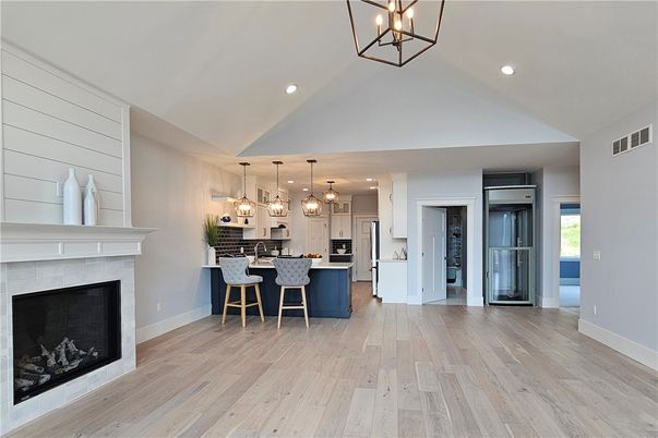 Fireplace, Interior, Kitchen, Pendant Lights, Recessed Lighting, Stainless Steel Appliances, Wood Texture Flooring