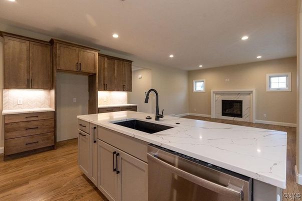 Fireplace, Interior, Kitchen, Recessed Lighting, Stainless Steel Appliances, Wood Texture Flooring