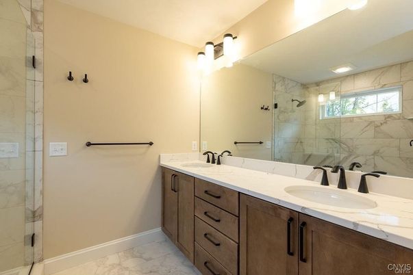 Bathroom, Dual Sink Vanities, Glass Shower, Interior, Marble, Marble Walls, Recessed Lighting