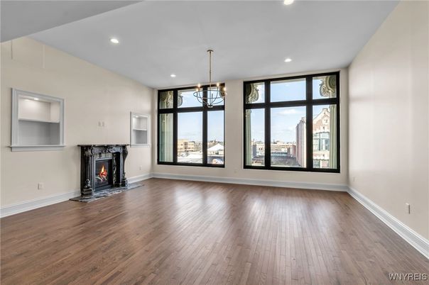 Chandelier, Empty room, Fireplace, Interior, Recessed Lighting, Wood Texture Flooring