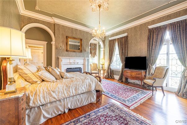 Bedroom, Chandelier, Fireplace, Interior, Wood Texture Flooring