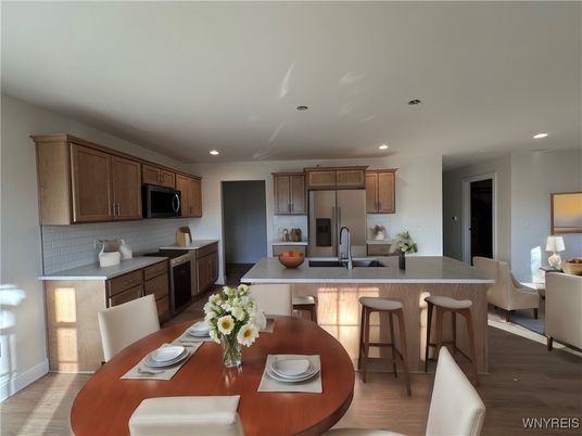 Dining room, Interior, Kitchen, Recessed Lighting, Stainless Steel Appliances, Wood Texture Flooring