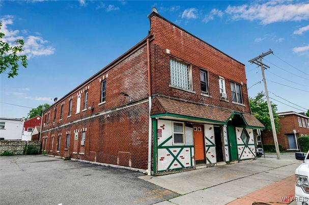 Exterior, Facade, Brick Facade, Condo Building