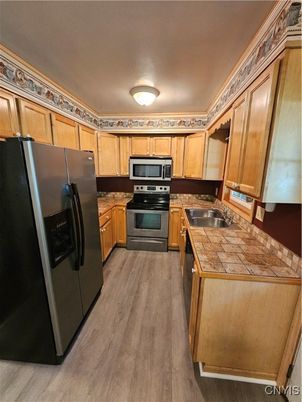 Interior, Kitchen, Tile Countertops, Wood Texture Flooring