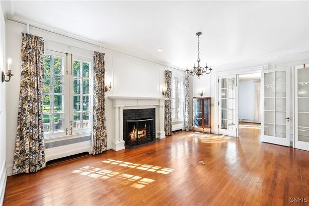 Chandelier, Empty room, Fireplace, Interior, Recessed Lighting, Wood Texture Flooring
