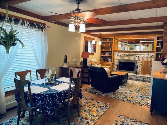 Dining room, Fireplace, Interior, Living room, Pendant Lights, Wooden Beams, Wood Texture Flooring