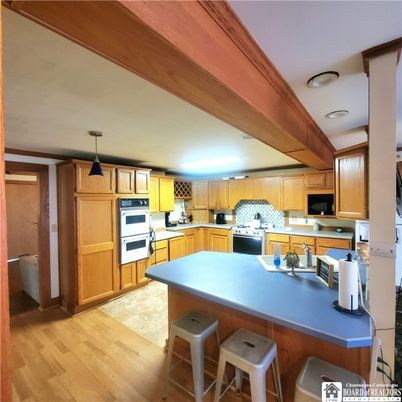 Interior, Kitchen, Pendant Lights, Stainless Steel Appliances, Wood Texture Flooring