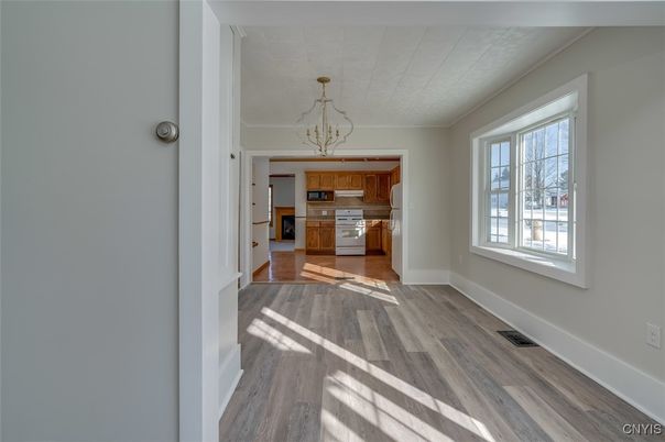 Chandelier, Empty room, Interior, Kitchen, Pendant Lights, Stainless Steel Appliances, Wood Texture Flooring