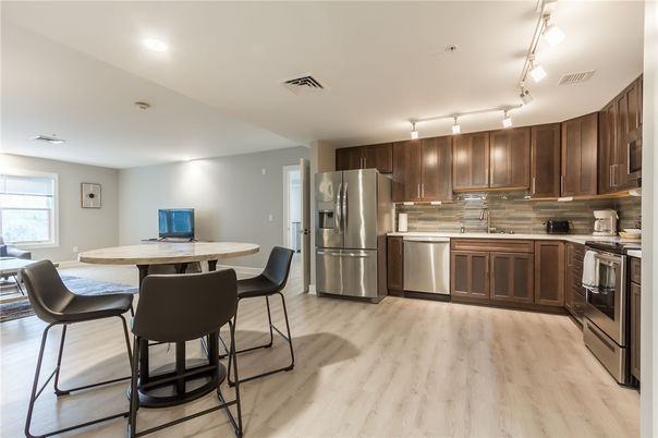Dining room, Interior, Kitchen, Recessed Lighting, Stainless Steel Appliances, Wood Texture Flooring