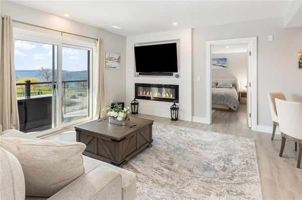 Bedroom, Fireplace, Interior, Living room, Recessed Lighting, Water, Wood Texture Flooring
