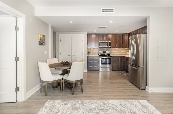 Dining room, Interior, Kitchen, Recessed Lighting, Stainless Steel Appliances, Wood Texture Flooring
