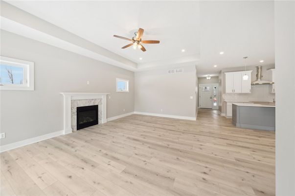 Empty room, Fireplace, Interior, Kitchen, Pendant Lights, Recessed Lighting, Wood Texture Flooring