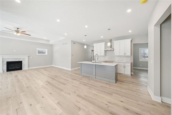 Empty room, Fireplace, Interior, Kitchen, Pendant Lights, Recessed Lighting, Wood Texture Flooring