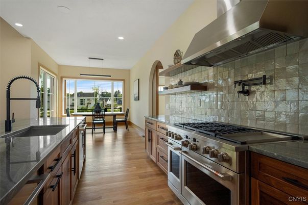 Dining room, Interior, Kitchen, Pendant Lights, Recessed Lighting, Stainless Steel Appliances, Wood Texture Flooring