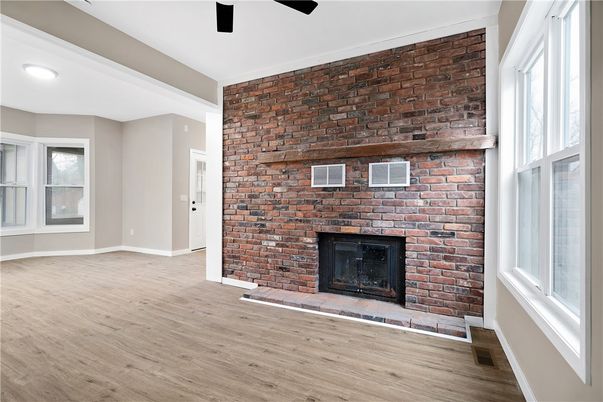 Empty room, Fireplace, Interior, Recessed Lighting, Stone Walls, Wood Texture Flooring