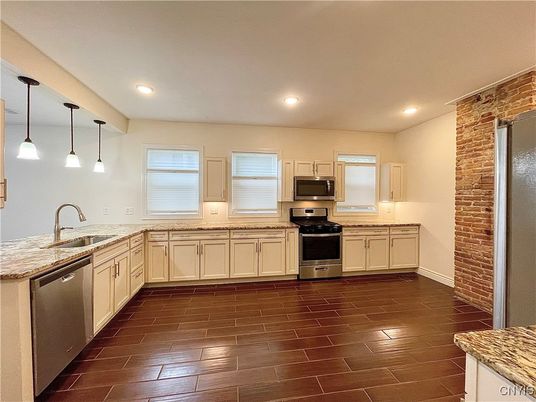 Interior, Kitchen, Pendant Lights, Recessed Lighting, Stainless Steel Appliances, Stone Walls, Wood Texture Flooring