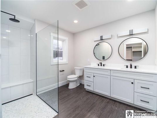 Bathroom, Dual Sink Vanities, Glass Shower, Interior, Recessed Lighting, Wood Texture Flooring