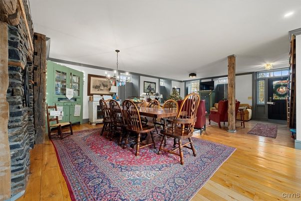 Chandelier, Dining room, Fireplace, Interior, Living room, Recessed Lighting, Wood Texture Flooring