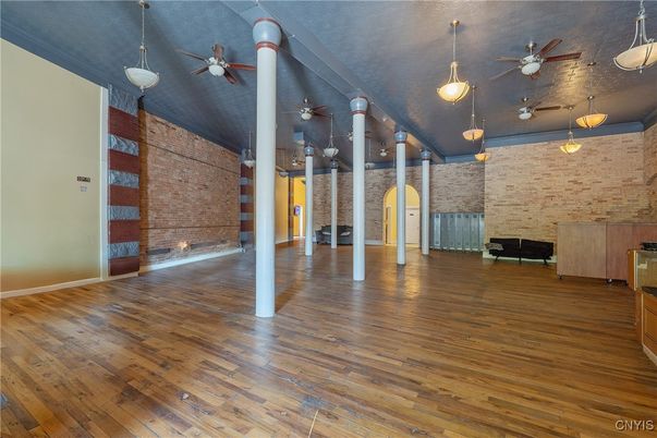 Empty room, Fireplace, Interior, Pendant Lights, Stone Walls, Wood Texture Flooring